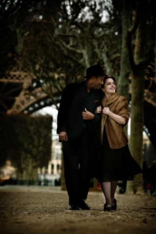 Walking and teasing near the base of the Eiffel Tower.